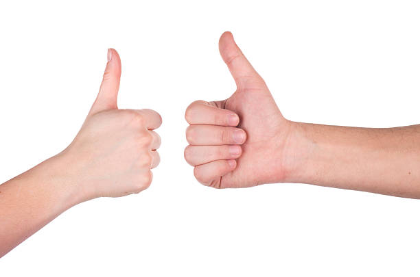 istock Hands showing thumbs up toward each other on white background. 465919410