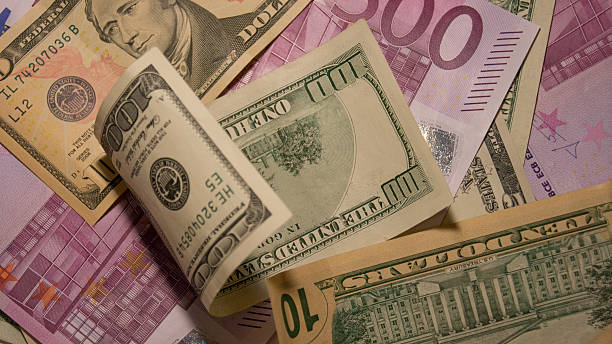 istock Lot of different dollars and euros bills. 465919584