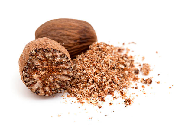 nutmeg isolated on white background stock photo