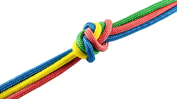 Tie from colorful ropes isolated on white