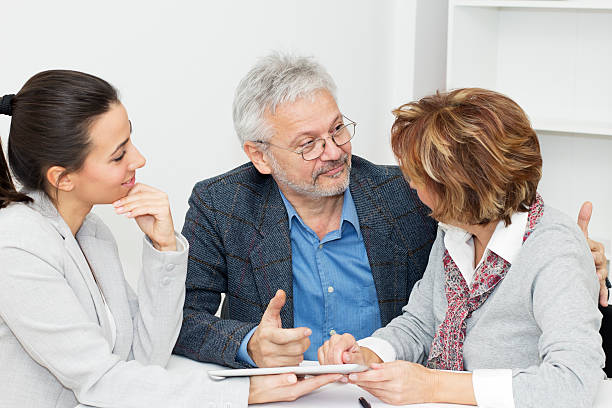 istock Mature couple meeting with advisor 465923497