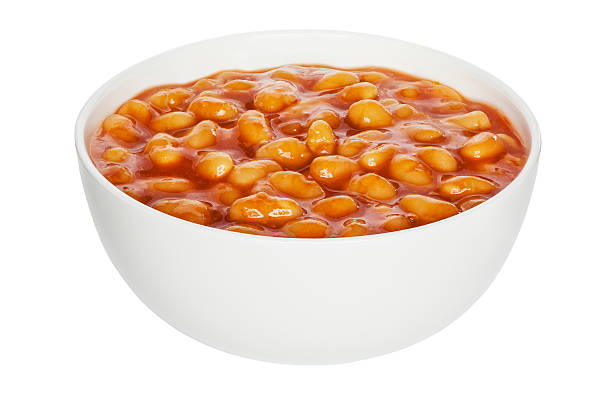 Baked Beans Cutout Baked Beans in a white china bowl, front to back focus, clipping path. baked beans stock pictures, royalty-free photos & images