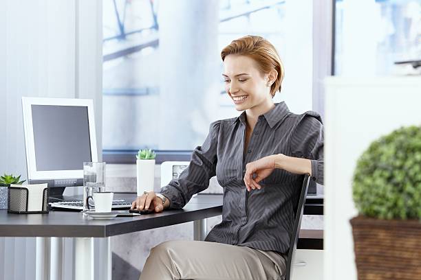 istock Happy businesswoman sitting in office 465927093