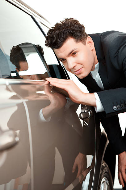 istock Handsome young man in dealership 465927288