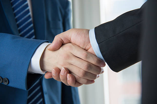 business people handshaking stock photo