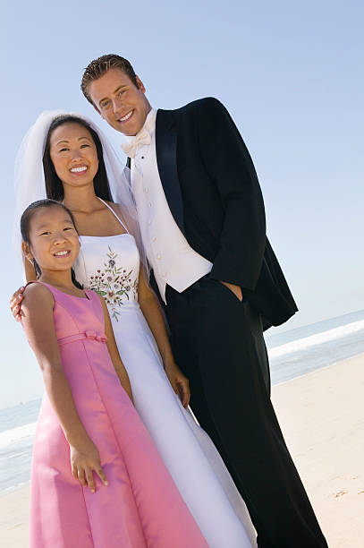 istock Bride and Groom With Sister on Beach 465930675