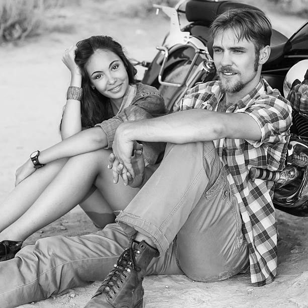 istock Biker man and girl 465931281