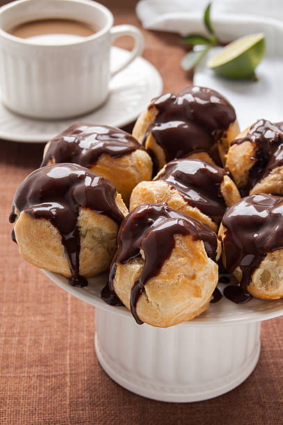 istock Homemade profiteroles with chocolate cream 465931489