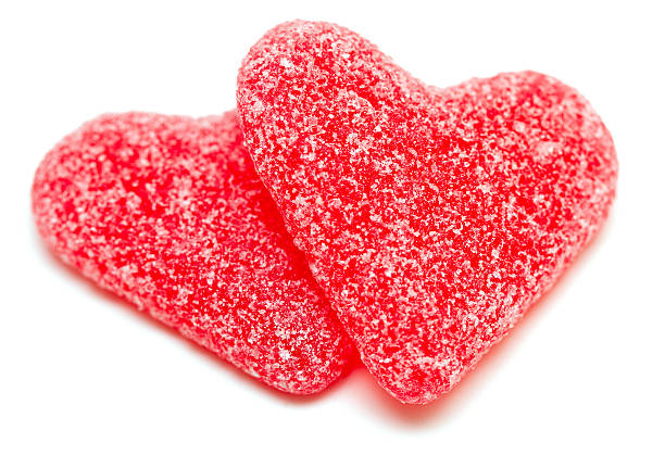 istock two heart-shaped candies isolated on white background 465933429