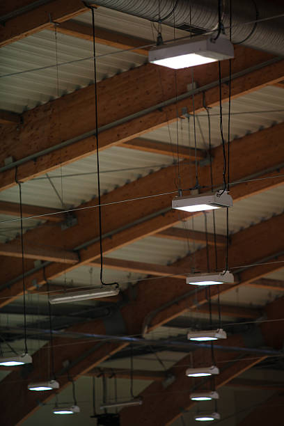 istock Group of lamps on sport stadium celling. Light power energy 465935543