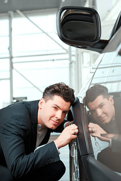 istock Handsome young man in dealership 465938832