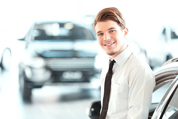 istock Handsome young man in dealership 465938860