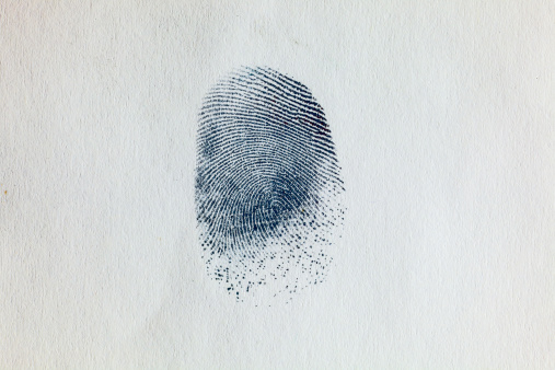 Thumbprint on paper. Macro. Highly detailed and ready for a beautiful crop.