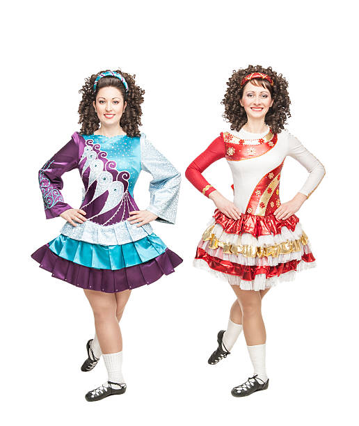 istock Two young women in irish dance dresses posing isolated 465940589