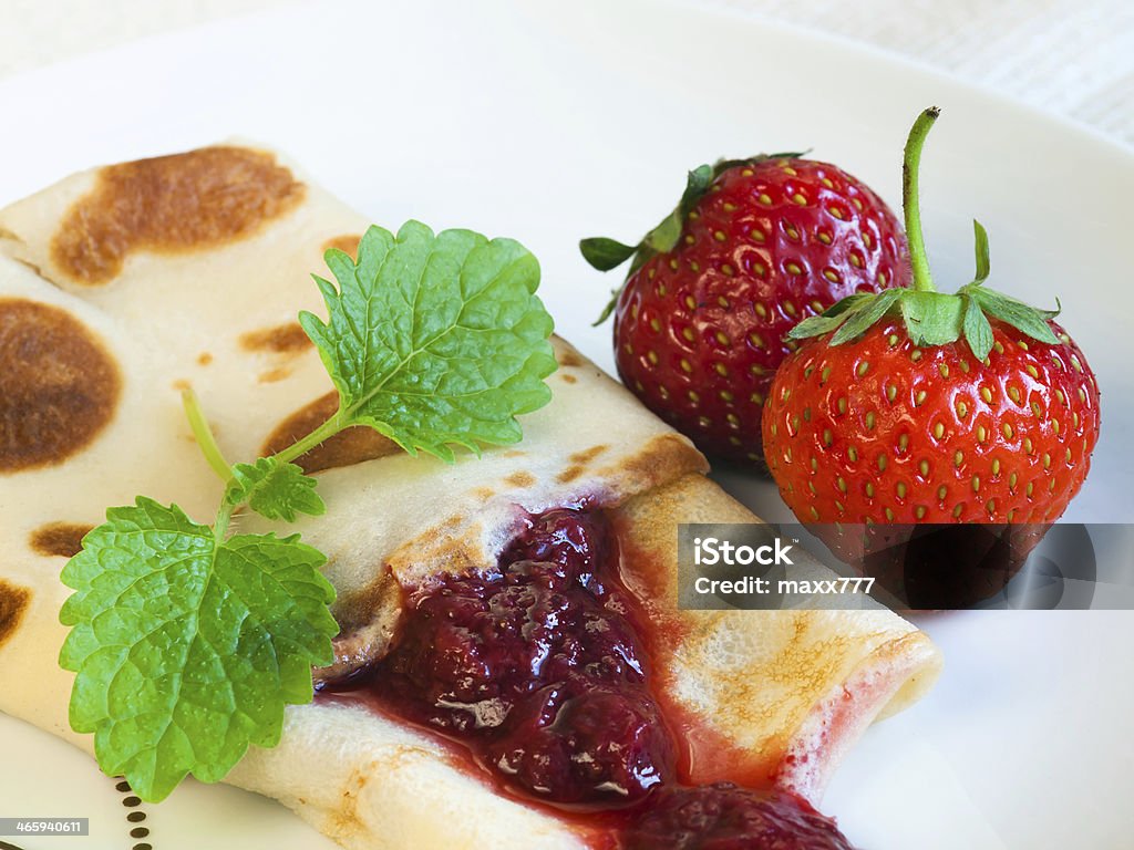 Rolled pancakes with strawberries Rolled pancakes in my studio Baked Stock Photo