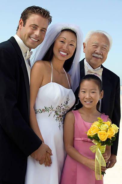 istock Bride And Groom With Guests Standing Against Sky 465940795