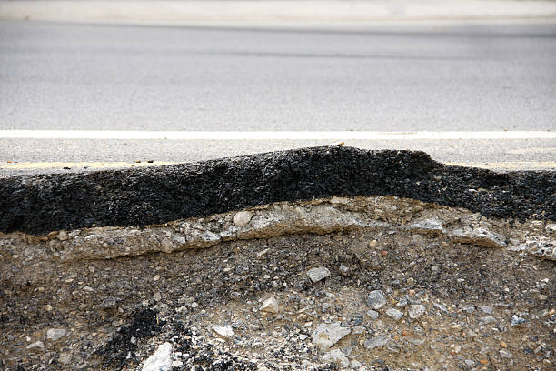 istock asphalt road was collapsed and dent 465942029