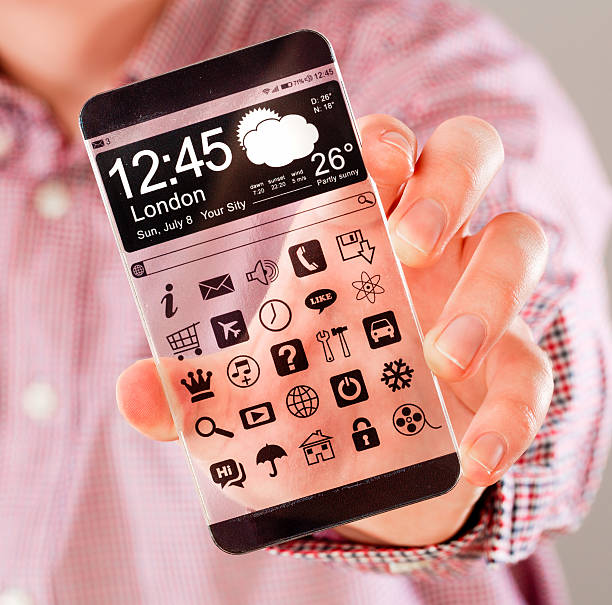 istock Smartphone with transparent screen in human hands. 465942563