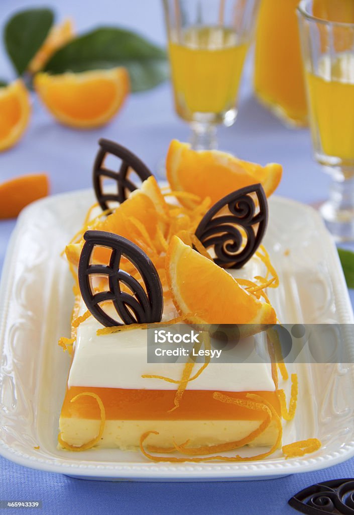 Creamy orange jelly with tangerines and chocolates. Blue Curacao Stock Photo