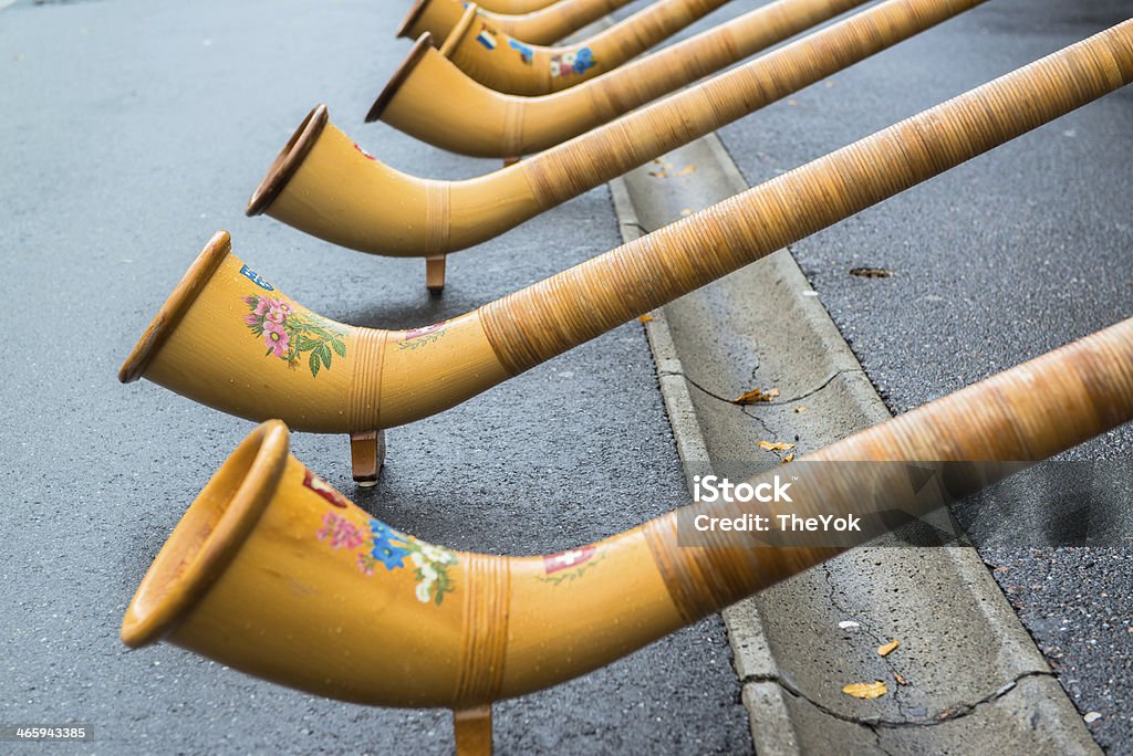 song from  Alphorn LUCERNE, SWITZERLAND - OCT 27, 2013   A group of musicians lined the streets of Lucerne and play traditional song from  Alphorn  to cheer up the marathon runners on the SWISS CITY MARATHON Activity Stock Photo