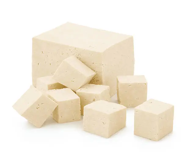 Block and cubes of Tofu isolated on white
