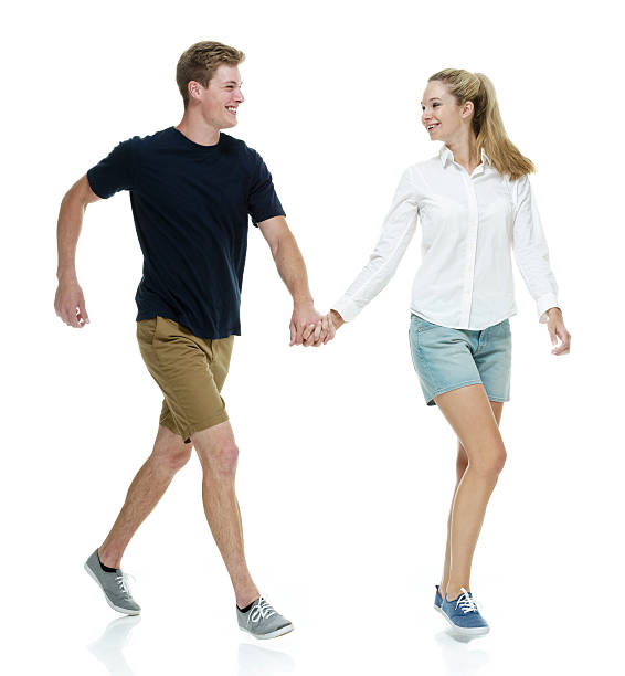 istock Smiling couple running with holding hands 465944780