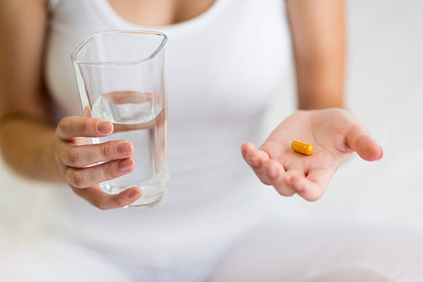 istock Woman taking medicine 465944786