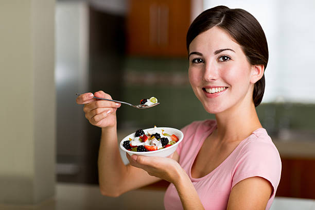 istock Woman having fruits 465944816
