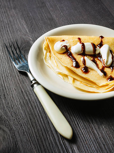 istock Closeup of chocolate pancakes with whipped cream 465945689