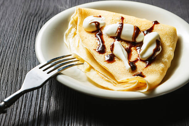 istock Closeup of chocolate pancakes with whipped cream 465945707