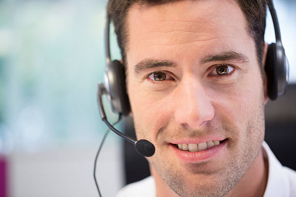 istock Close-up of a smiling man with a phone headset on 465945767