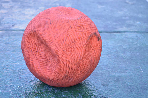 istock Old empty air orange ball on the grond 465946259