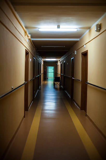 istock Wheelchair at a hospital corridor 465947766