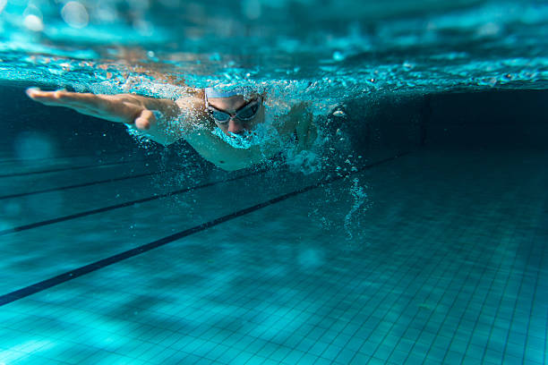 istock Male swimmer swimming underwater in a pool 465947770