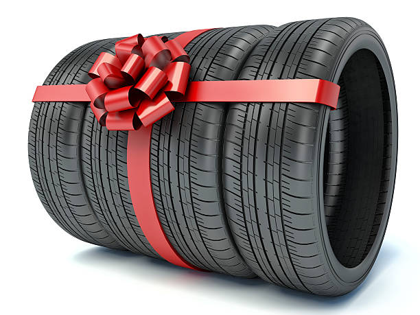 istock Tyres with a red ribbon. Present. 3D 465951200