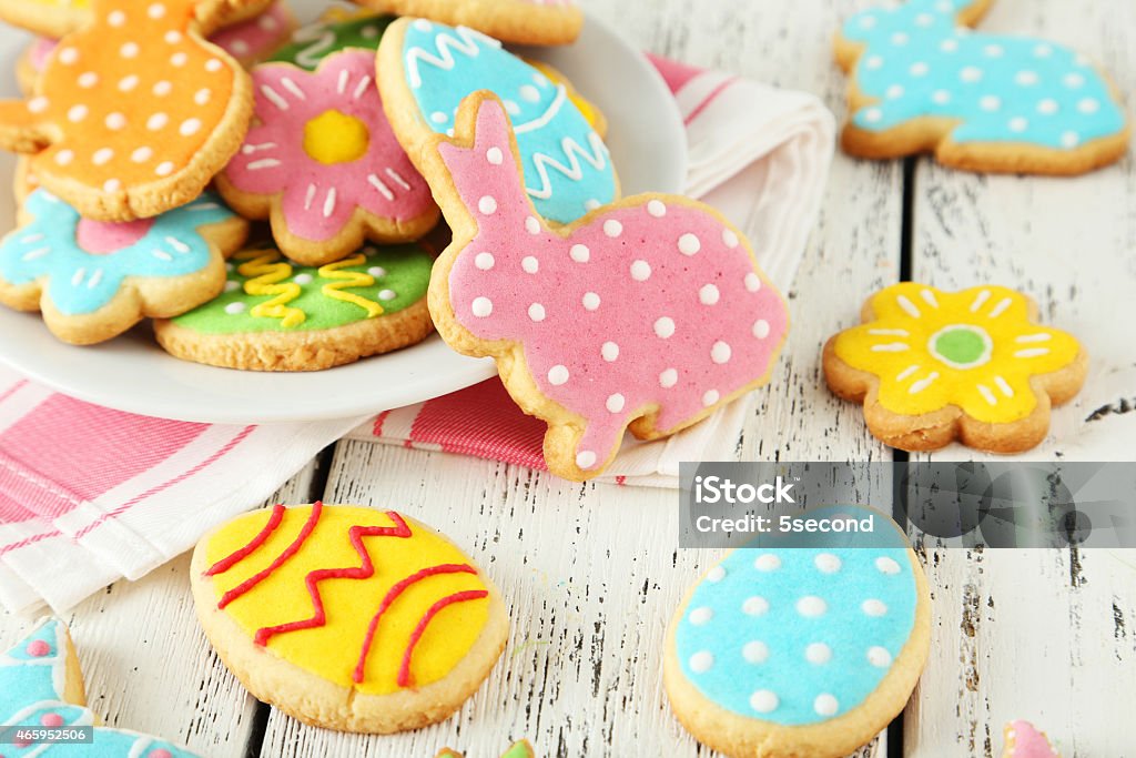 Colorful easter cookies on white wooden background Easter Stock Photo