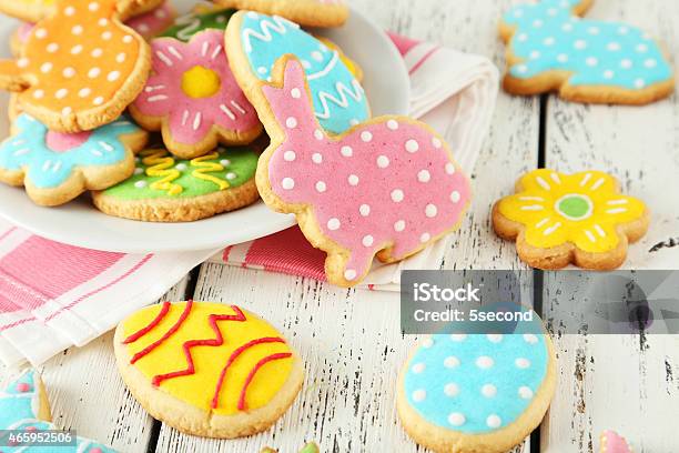 Colorful Easter Cookies On White Wooden Background Stock Photo - Download Image Now - Easter, Cookie, Baking