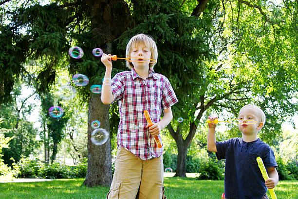 istock Little brother copying older sibling 465956336