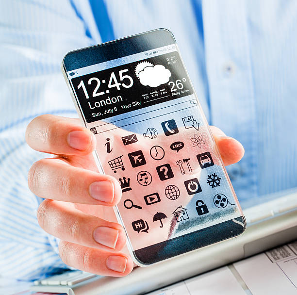 istock Smartphone with transparent screen in human hands. 465956473