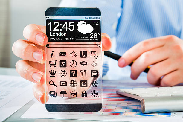 istock Smartphone with transparent screen in human hands. 465956609