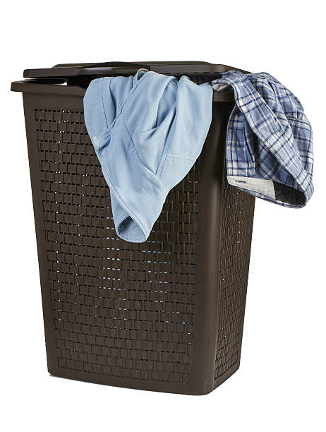 istock Bright clothes in a laundry closed basket on white background 465956857