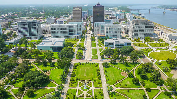 Aerial view of Baton Rouge city An aerial view of downtown Baton Rouge from the State Capitol building, looking towards the Mississippi bridge and river. baton rouge stock pictures, royalty-free photos & images