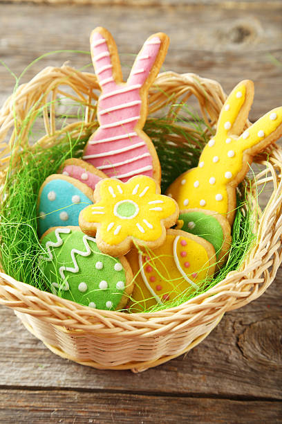 istock Colorful easter cookies in basket on grey wooden background 465957370