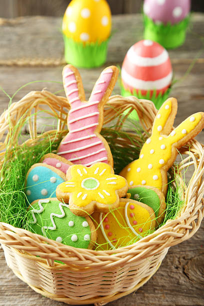 istock Colorful easter cookies in basket on grey wooden background 465957372