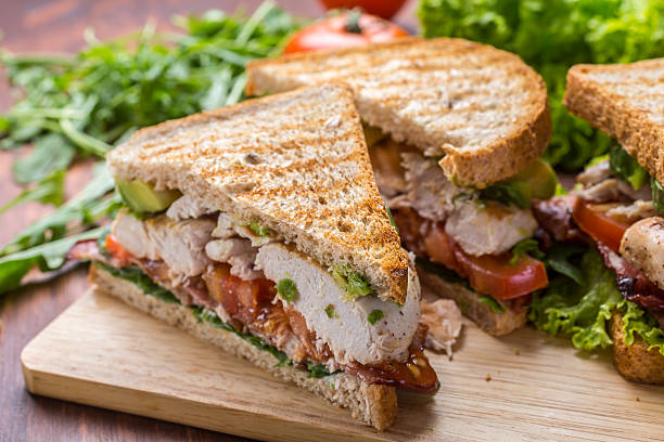 Bacon, Lettuce and Tomato BLT Sandwiches Grilled BLT Bacon, Lettuce and Tomato  Sandwiches with Chicken and Avocado sandwich stock pictures, royalty-free photos & images