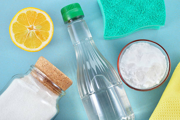 Natural cleaners. Vinegar, baking soda, salt and lemon. Eco-friendly natural cleaners. Vinegar, baking soda, salt, lemon and cloth. Homemade green cleaning. homemade stock pictures, royalty-free photos & images