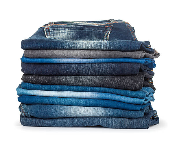 istock stack of different shades of blue jeans on a white background 465960694