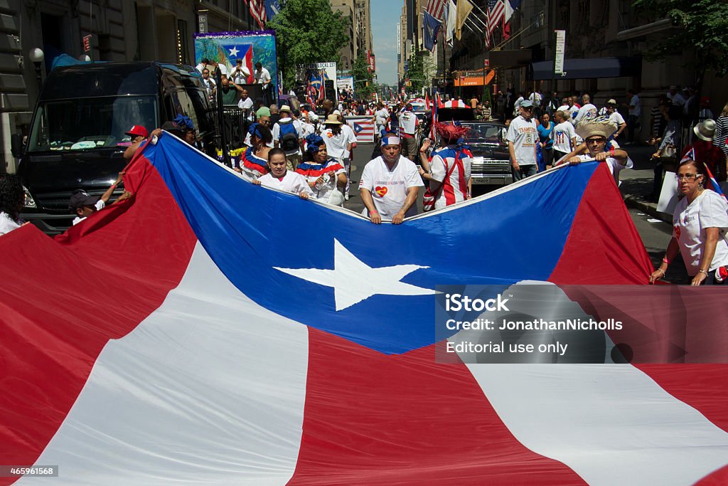 Peurto Rico Day Celebrations, New York City, June New York, NY, United States - June 8, 2014: A giant Puerto Rican Flag, carried along the route of the Puerto Rica Day Parade 2014 Stock Photo