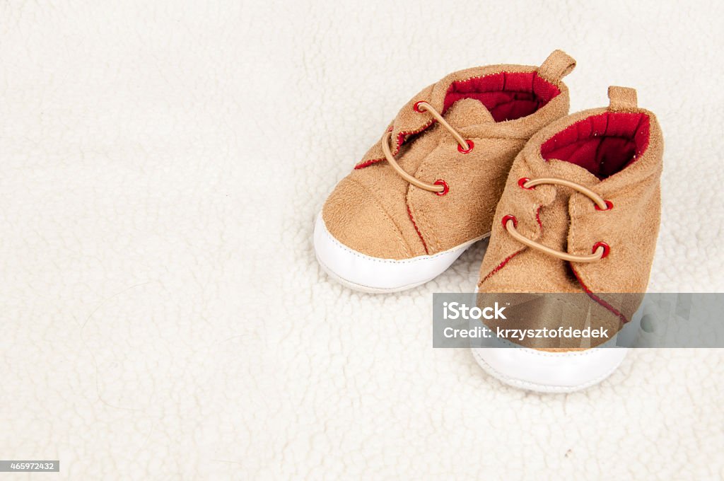 baby shoes pair of baby shoes on fur 2015 Stock Photo