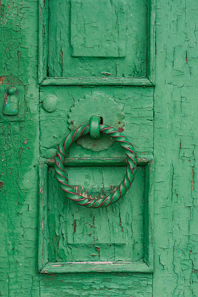 istock Old green door with a round handle 465972934